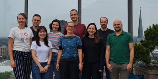 The participants of the Chair Colloquium on 6 September 2024 pose for a group photo at a vantage point. The skyline of Dortmund can be seen in the background.