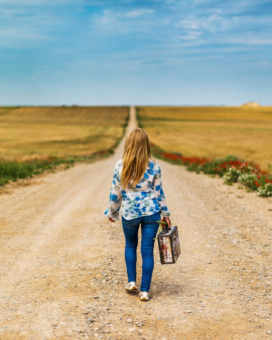 Woman walking with suitcase